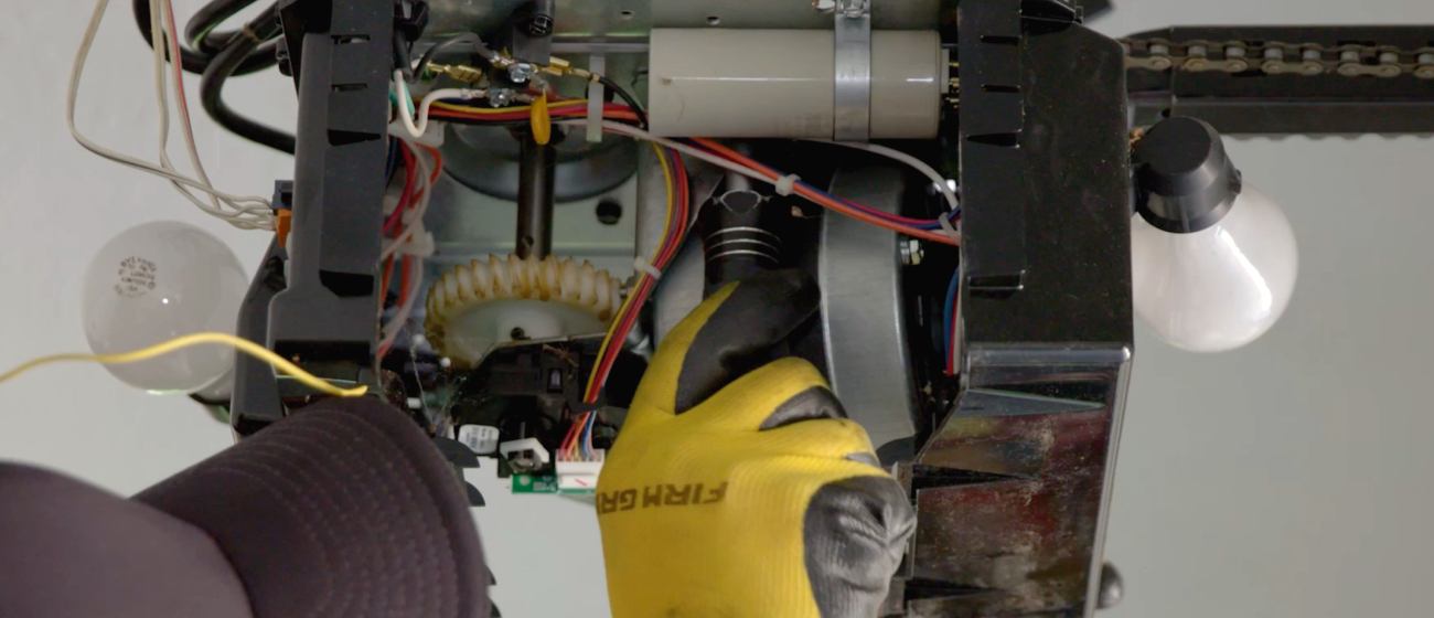 Precision Technician Installing a New Garage Door Opener