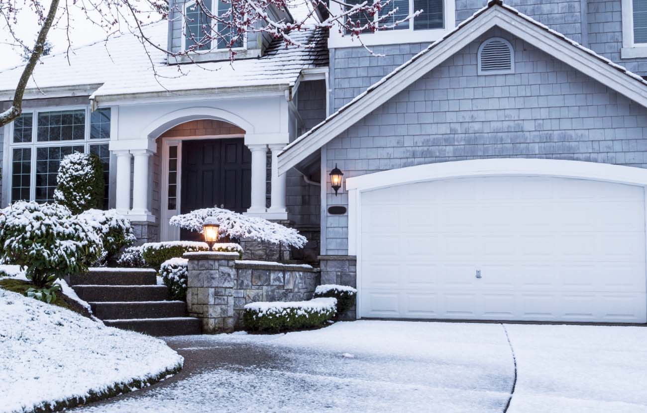 House and Driveway Covered in Snow
