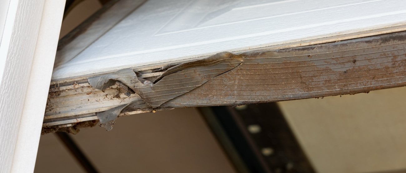 Frayed old garage door seal