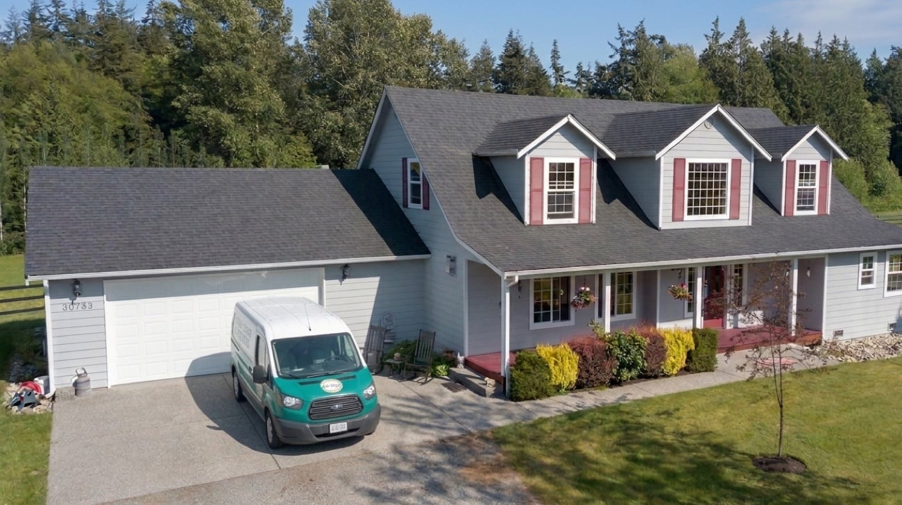 Exterior of home with Precision Garage Door Service truck in driveway Exterior of home with Precision Garage Door Service truck in driveway