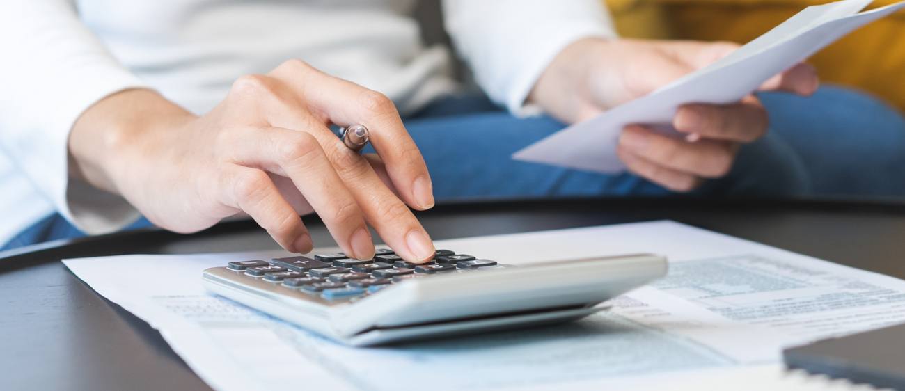 Person using calculator Person using calculator