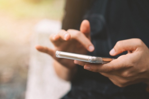 Person Opening Garage Door Via Their Phone