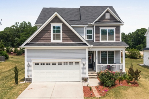 Frontal View of a House with a New Garage Door