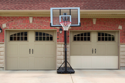 House with Two Door Garage and a Basketball Hoop