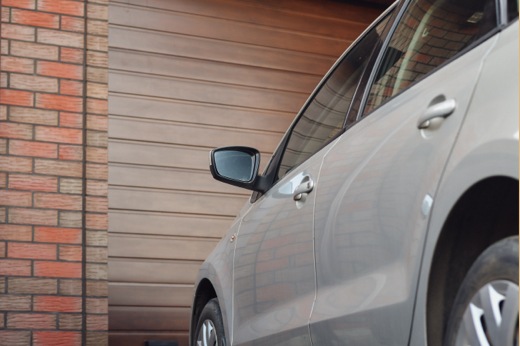 Car Parked in Front of Garage Door