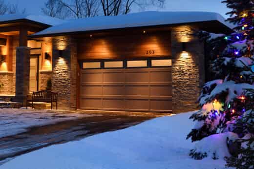 A Snowy Holiday Scene with Home Garage