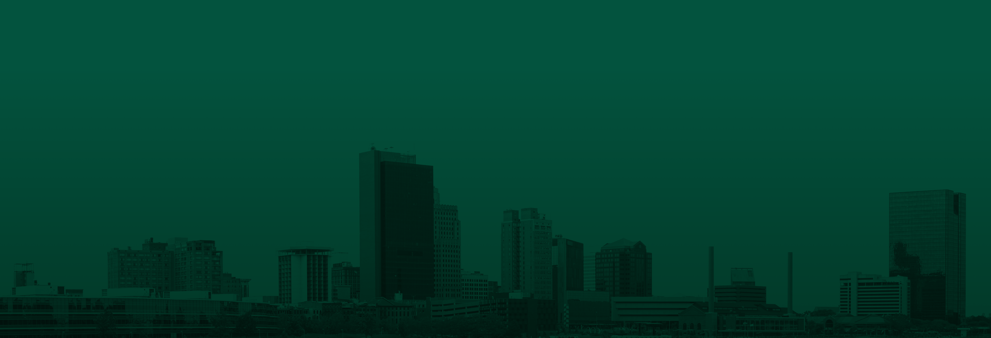 Green overlay on Toledo Ohio cityscape background .